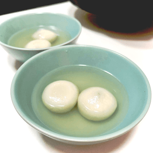 traditional sticky rice balls in ginger soup.